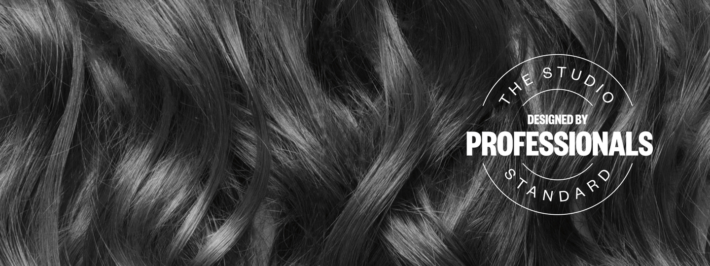 Professional studio standard seal reading 'designed by professionals' over flowing hair texture background