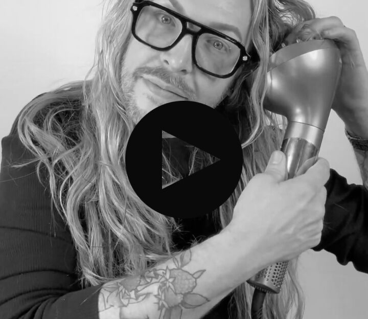 man with long hair using the style switch diffuser attachment